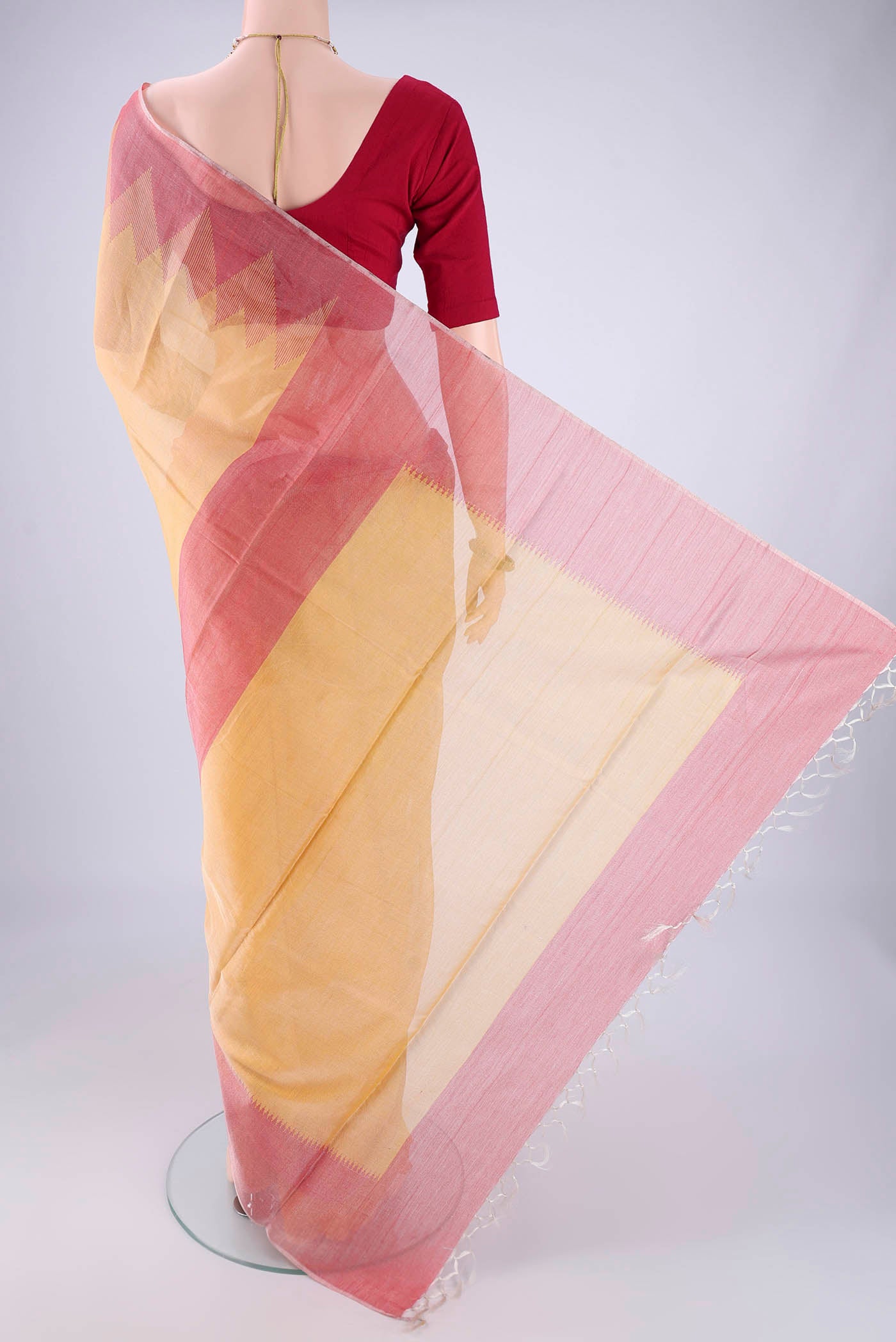 Flat view of Yellow MP Tussar Saree with Plain Body and Temple Border. 