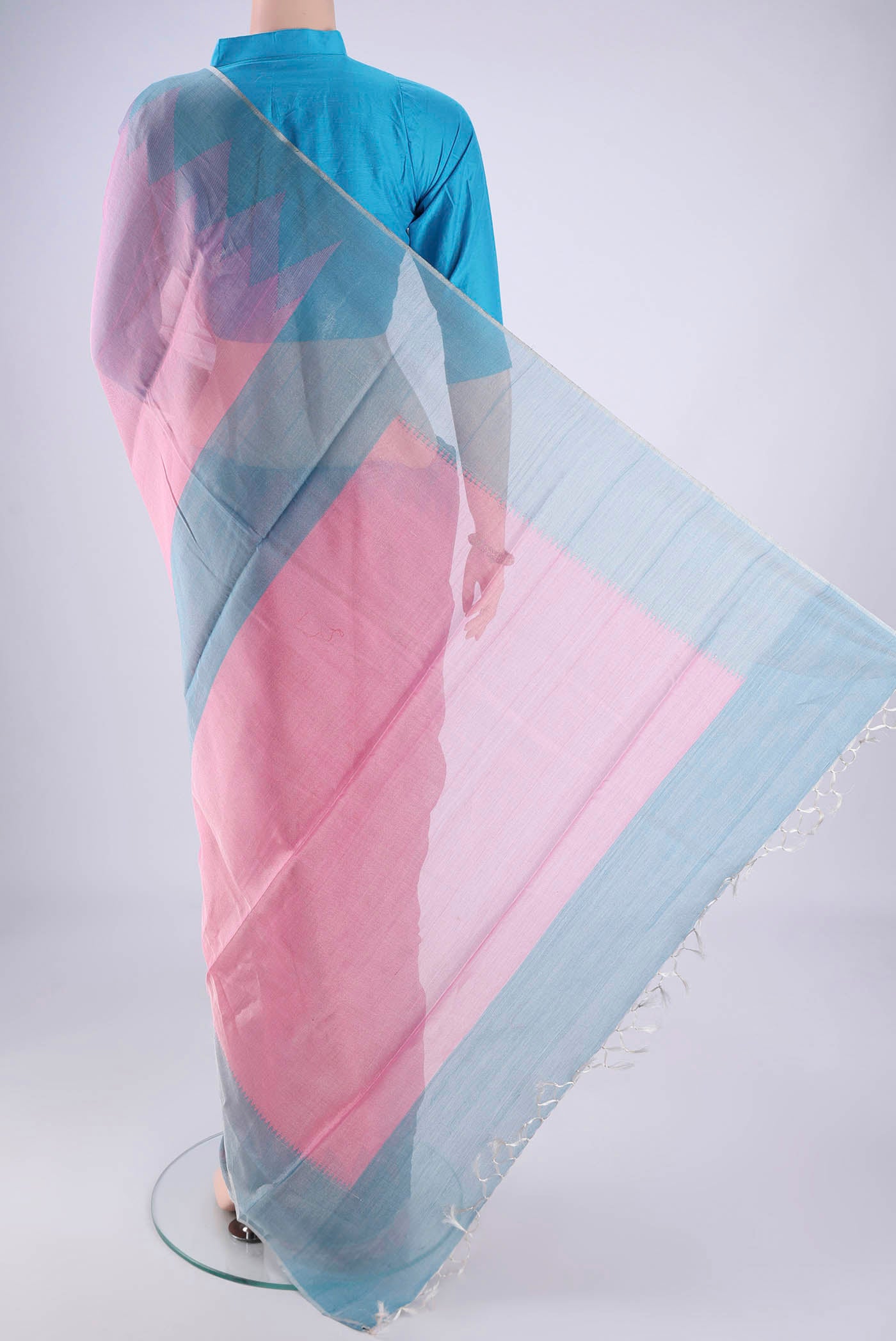 Flat view of Pink Tussar Silk Saree with Plain Body and Temple Border. 