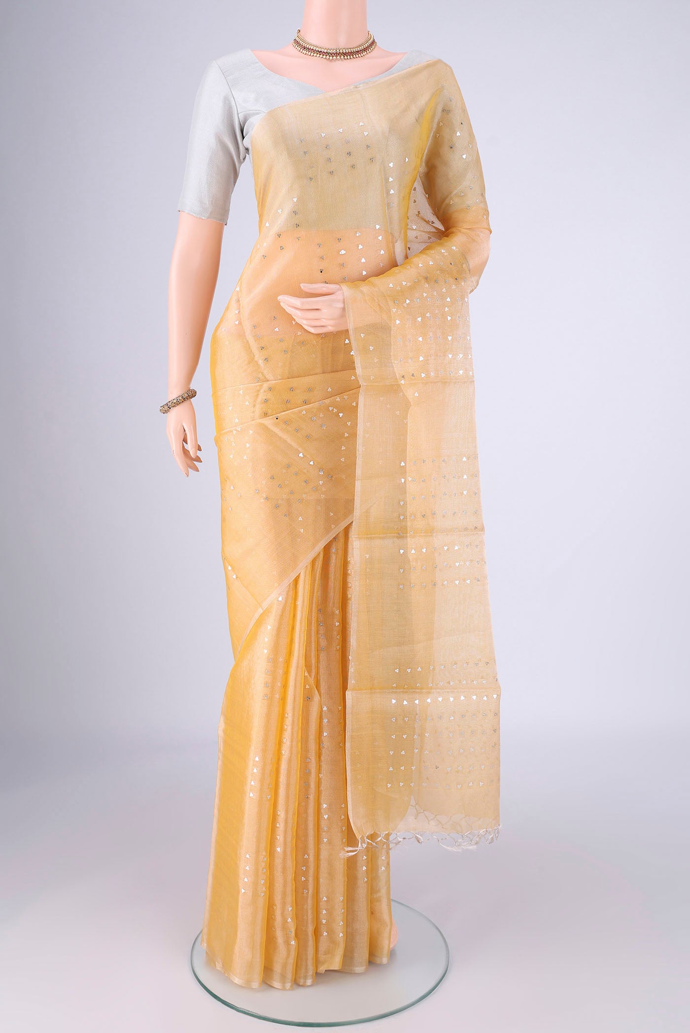 Lemon Yellow MP Tussar Saree with Embroidery on the body and Thin Zari Line.  displayed on a mannequin