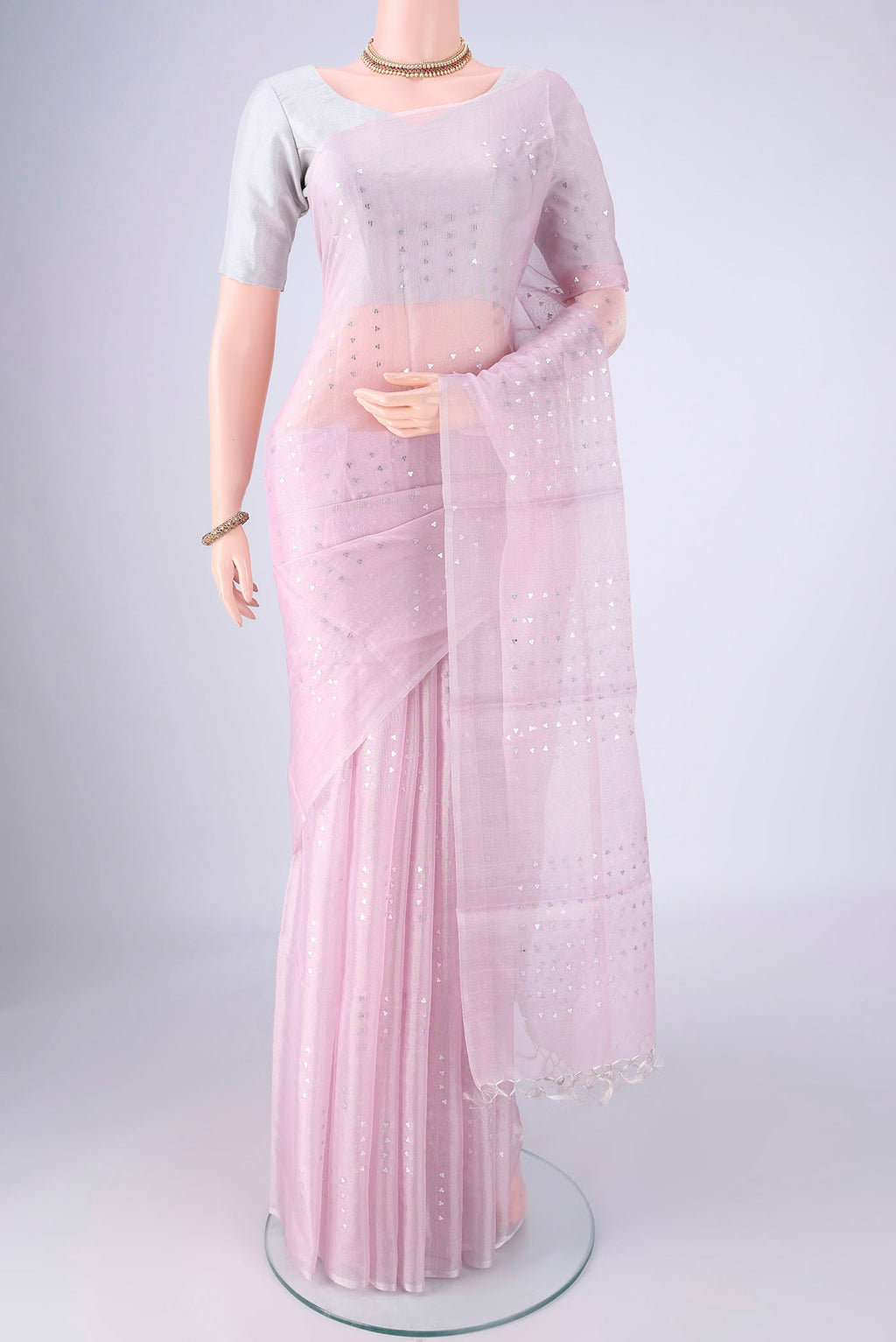 Rose pink MP Tussar Saree with Embroidery on the body and Thin Zari Line.  displayed on a mannequin