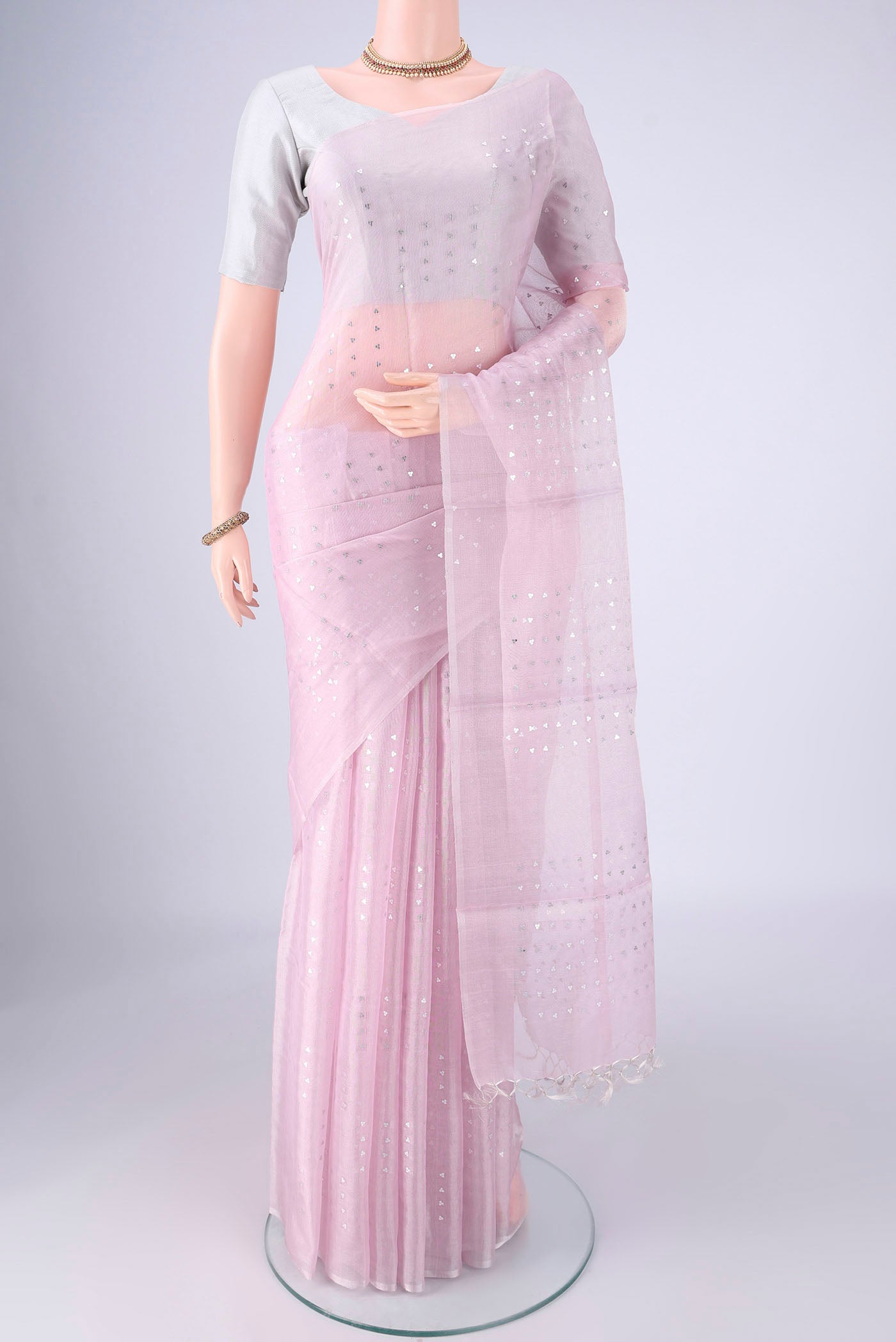 Rose pink MP Tussar Saree with Embroidery on the body and Thin Zari Line.  displayed on a mannequin
