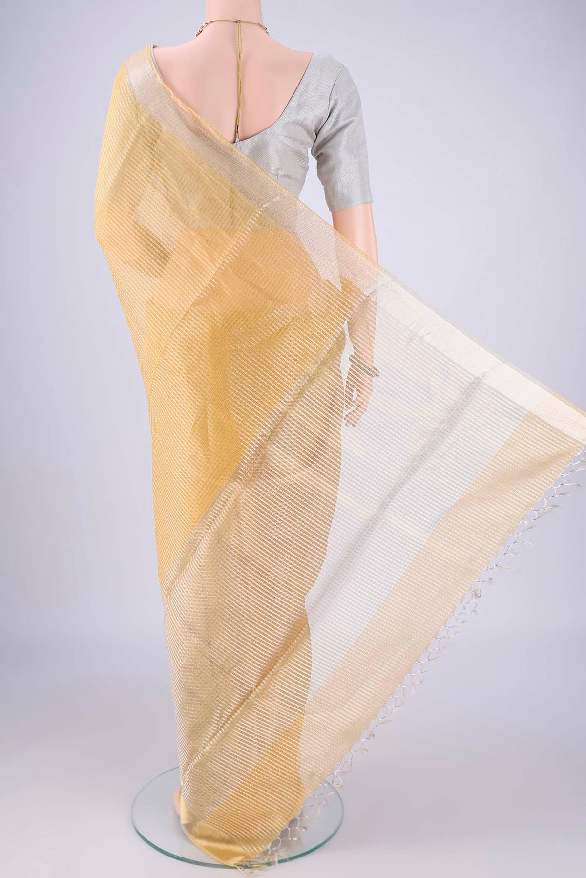 Flat view of Lemon Yellow MP Tussar Saree with Checked design on the body and Zari Border. 