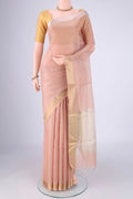 Peach Tussar Silk Saree with Checked design on the body and Zari Border.  displayed on a mannequin