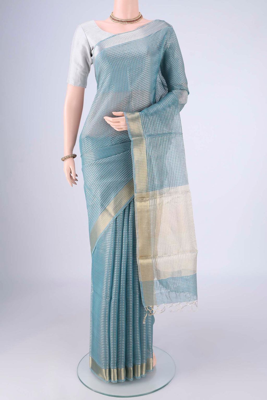 Sky Blue MP Tussar Saree with Checked design on the body and Zari Border.  displayed on a mannequin