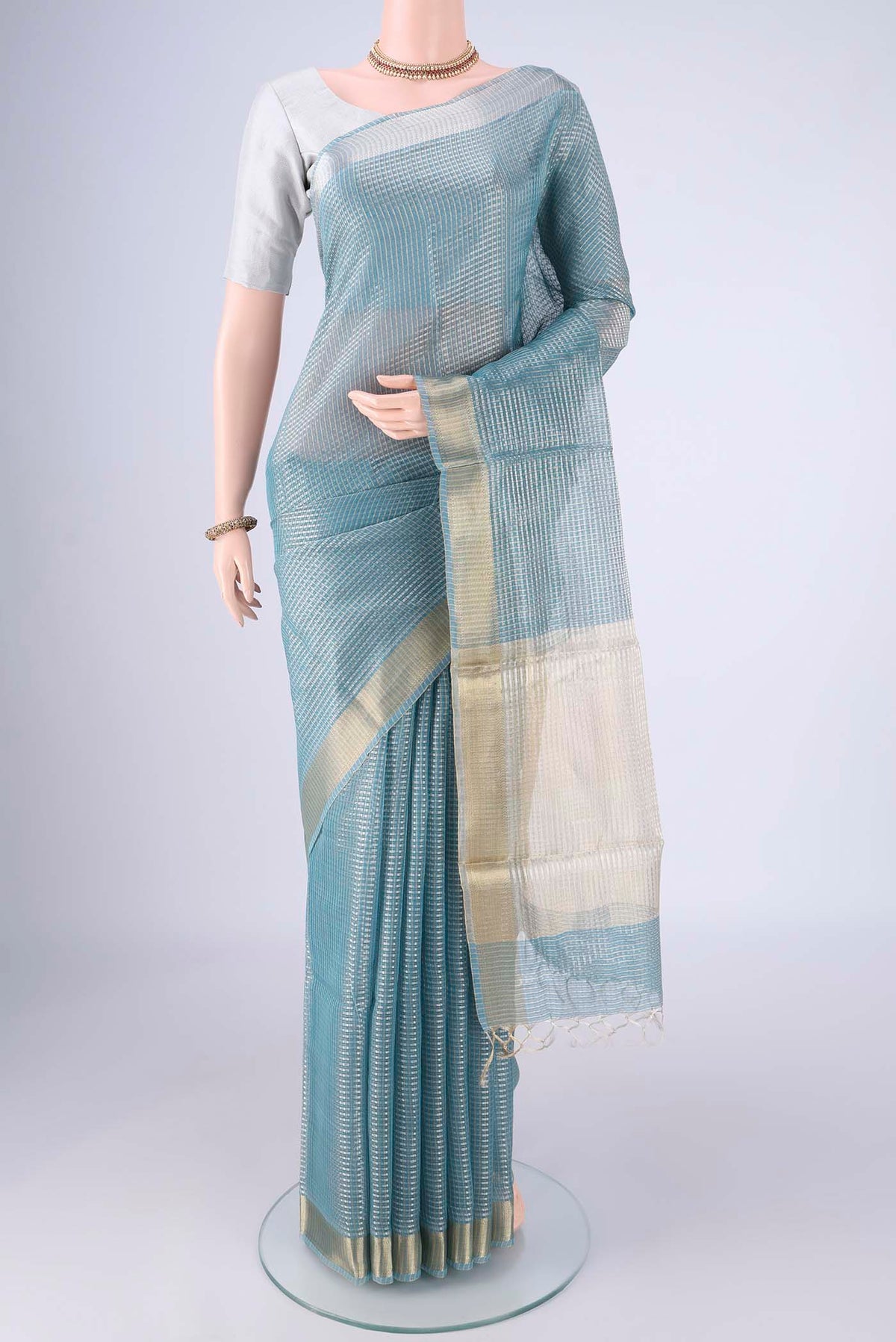 Sky Blue MP Tussar Saree with Checked design on the body and Zari Border.  displayed on a mannequin