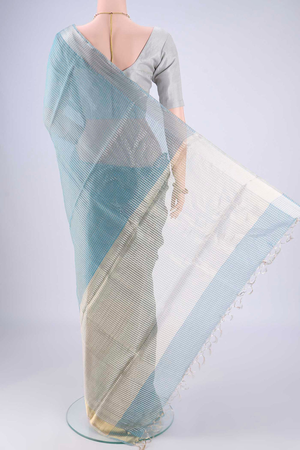 Flat view of Sky Blue MP Tussar Saree with Checked design on the body and Zari Border. 