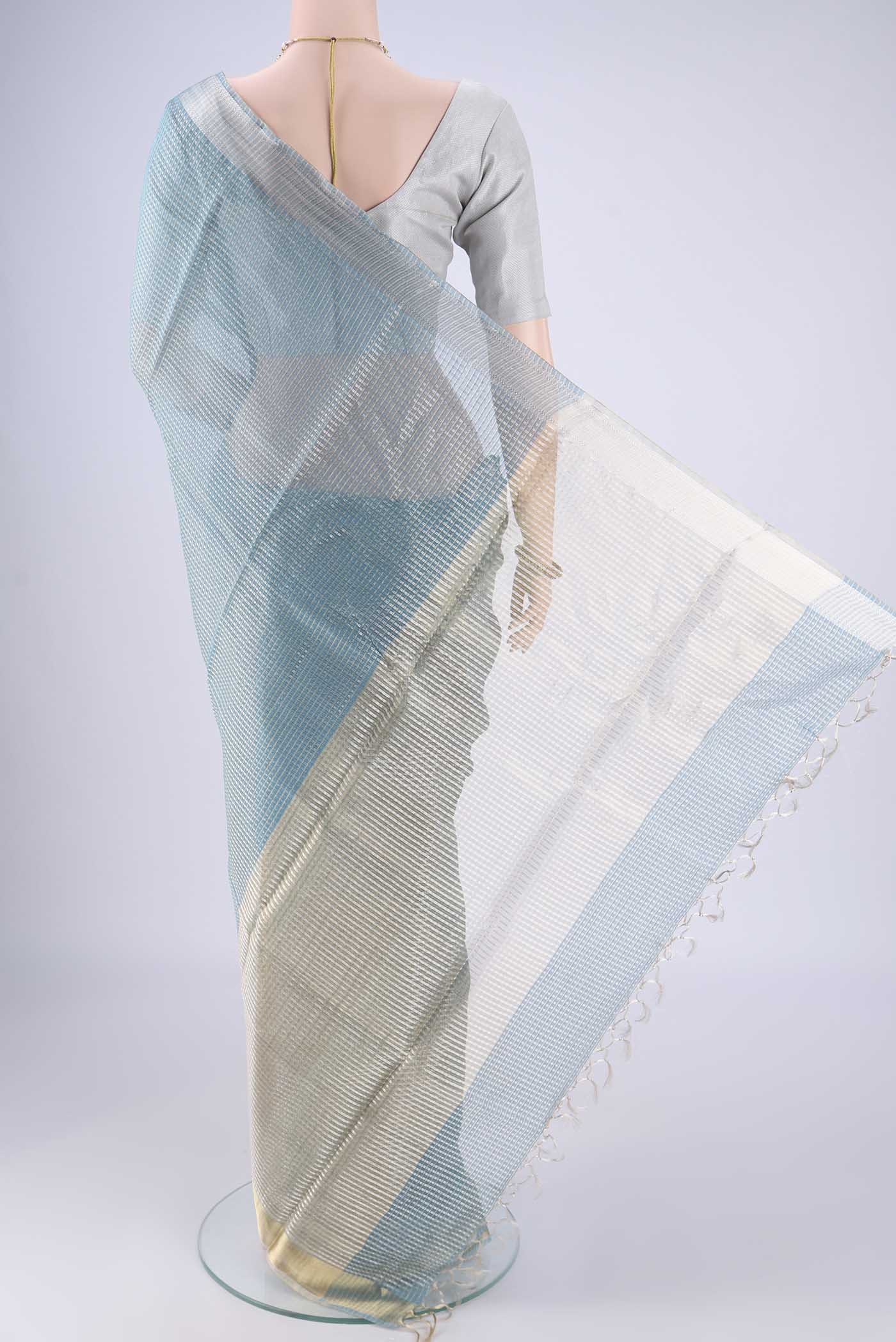 Flat view of Sky Blue MP Tussar Saree with Checked design on the body and Zari Border. 