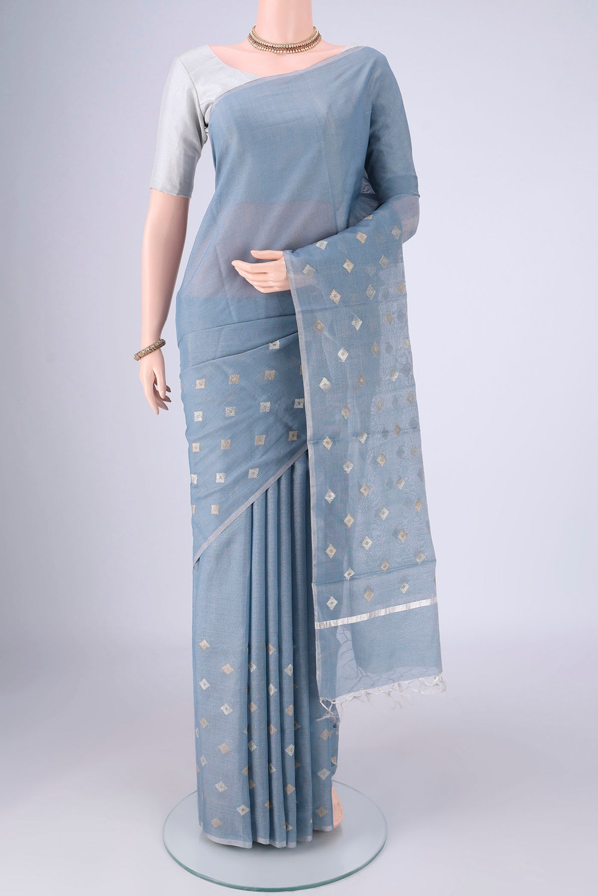 Sky Blue MP Tussar Saree with Zari Butta on the body and Thin Zari Line.  displayed on a mannequin