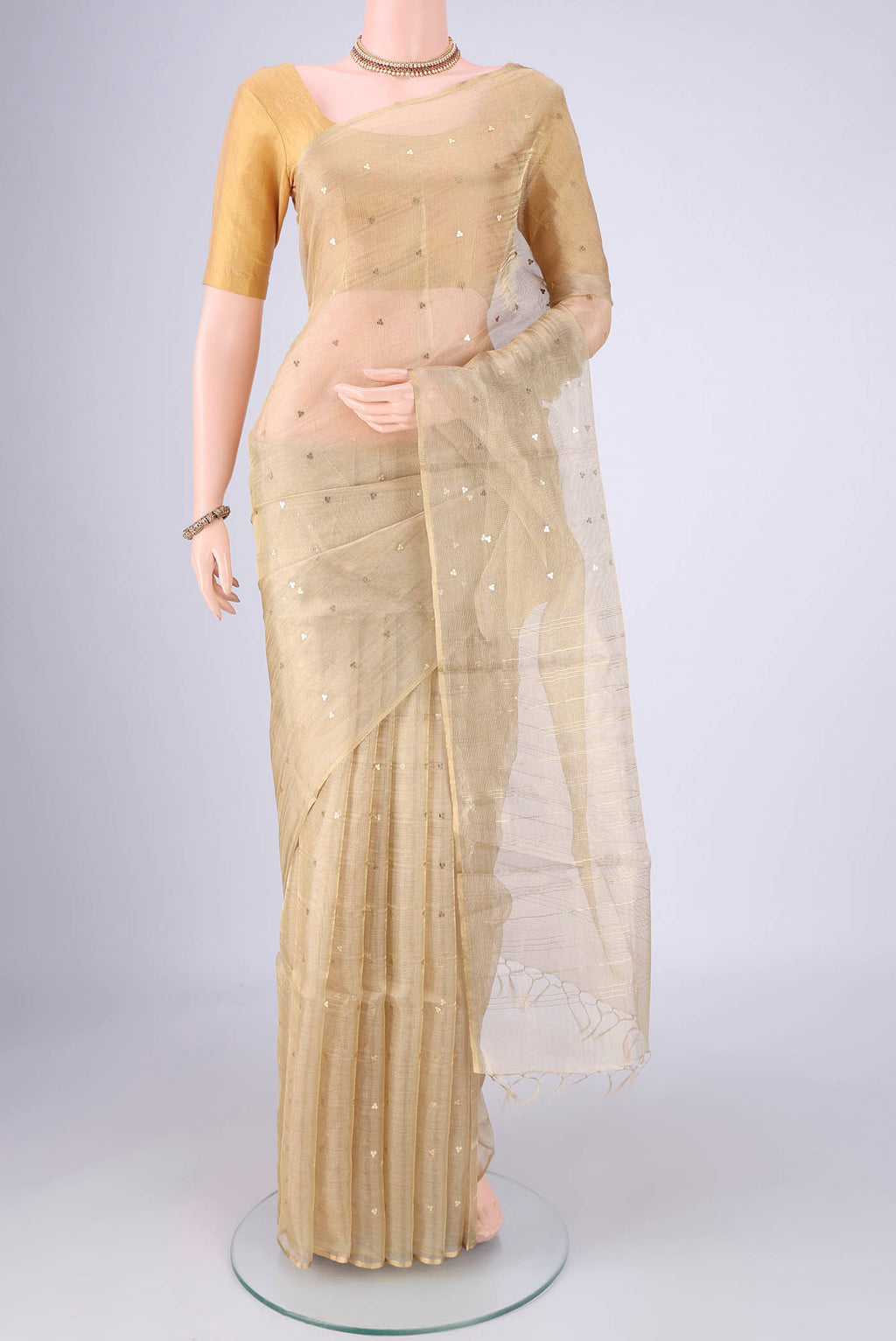 Dark Beige MP Tussar Saree with Embroidery on the body and Thin Zari Line.  displayed on a mannequin