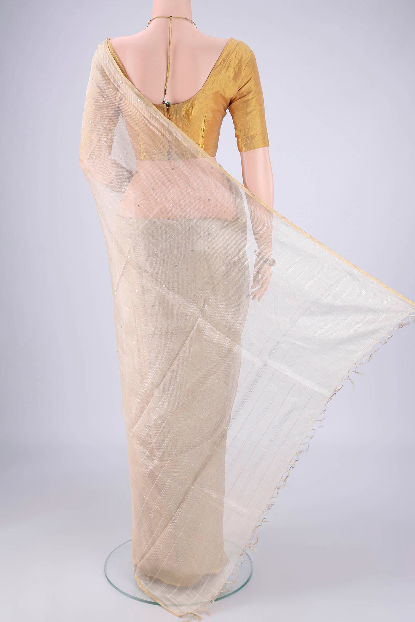 Flat view of Golden MP Tussar Saree with Embroidery on the body and Zari Border. 
