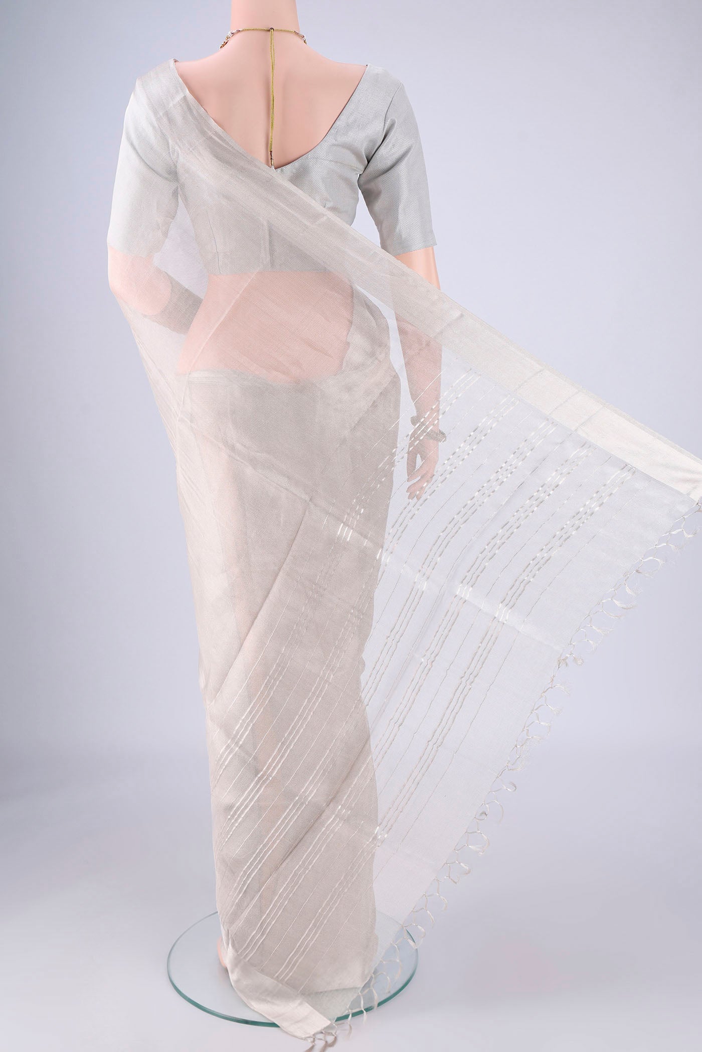 Flat view of Silver MP Tussar Saree with Plain Body and Zari Border. 