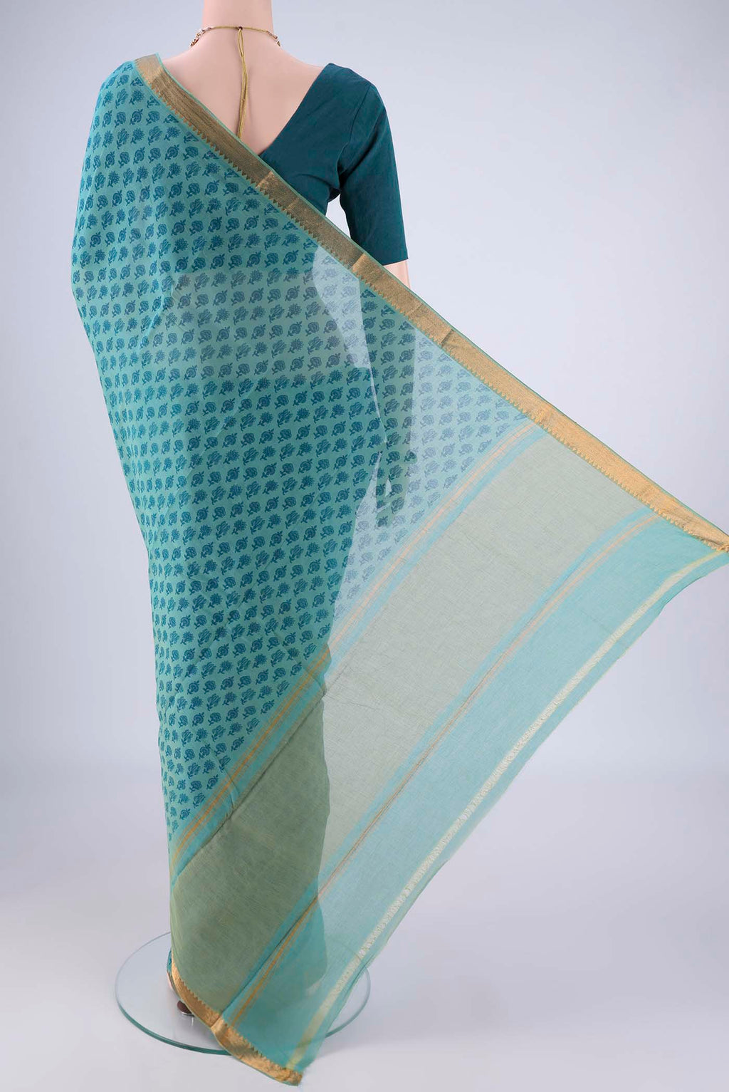 Flat view of Peacock Blue Mangalagiri Cotton Saree with Printed design on the body and Zari Border. 