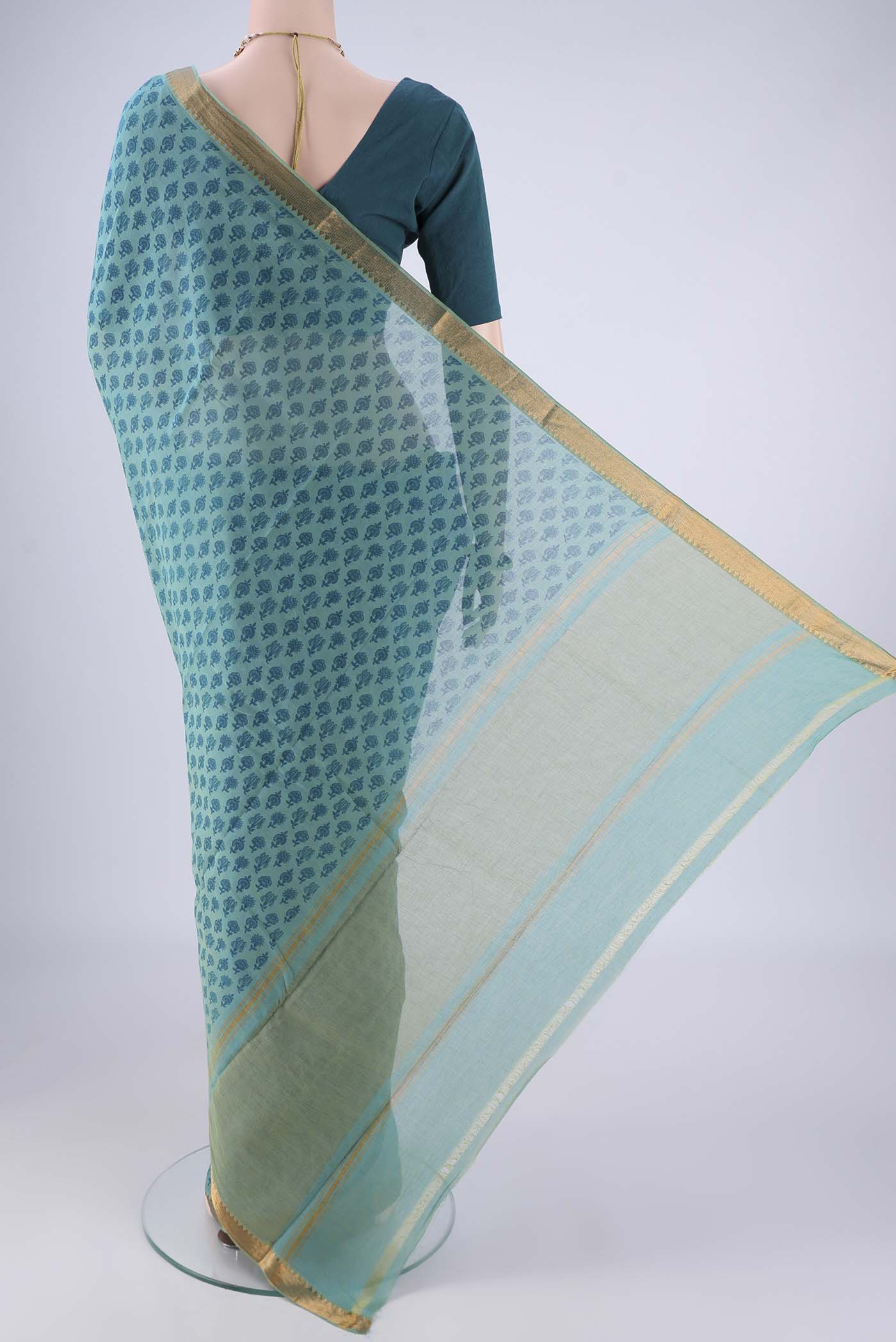 Flat view of Peacock Blue Mangalagiri Cotton Saree with Printed design on the body and Zari Border. 