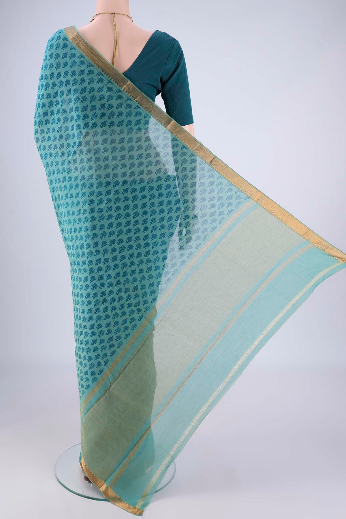 Flat view of Peacock Blue Mangalagiri Cotton Saree with Printed design on the body and Zari Border. 