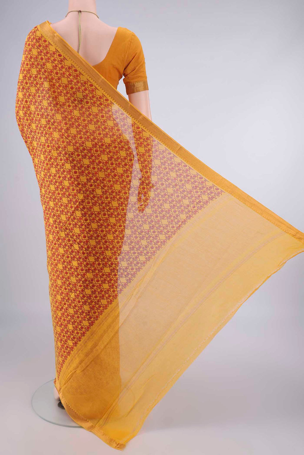 Flat view of Yellow Mangalagiri Cotton Saree with Printed design on the body and Zari Border. 