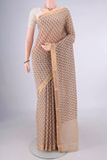 Beige Mangalagiri Cotton Saree with Printed design on the body and Zari Border.  displayed on a mannequin