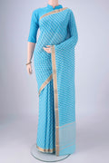 Sky Blue Mangalagiri Cotton Saree with Printed design on the body and Zari Border.  displayed on a mannequin