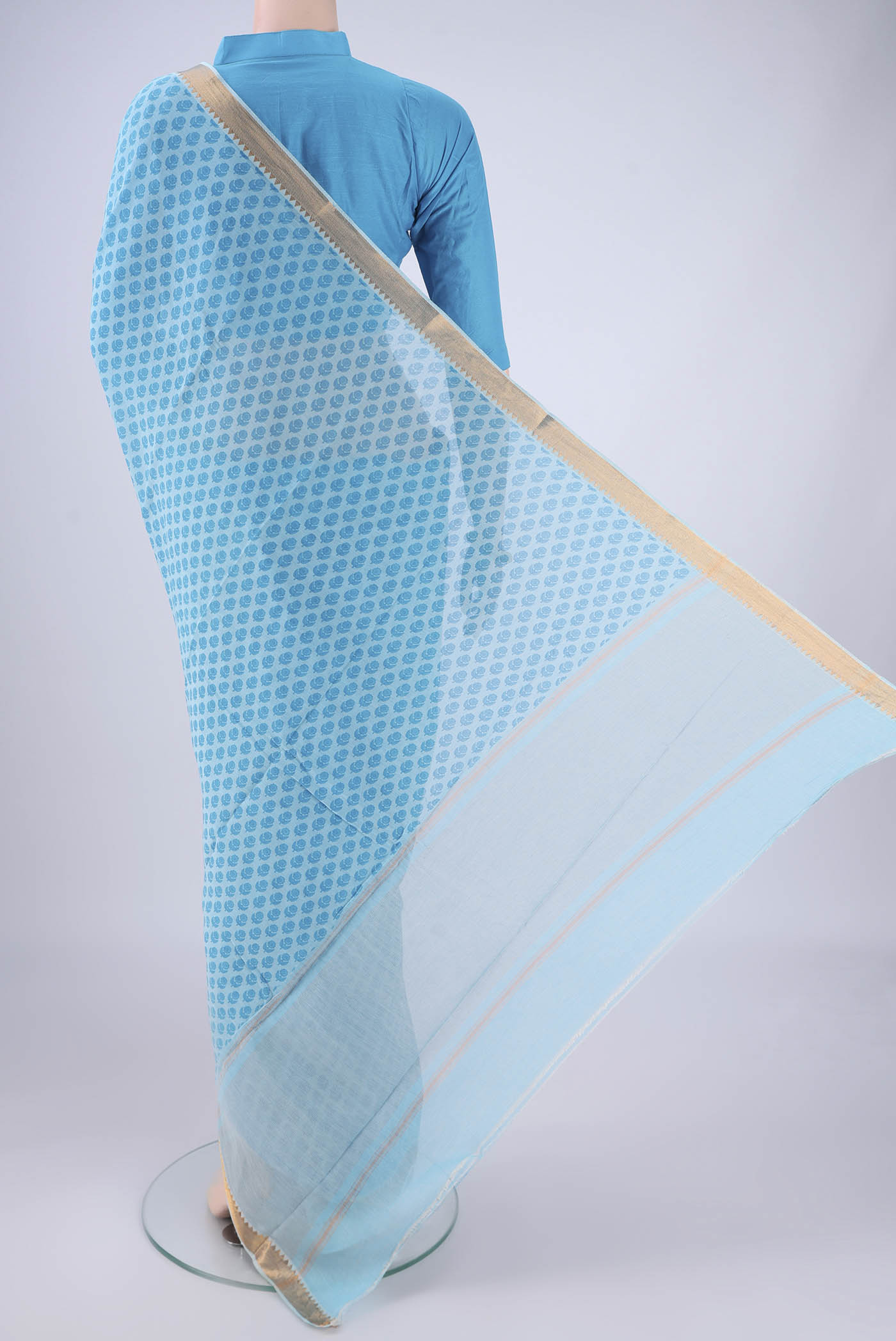 Flat view of Sky Blue Mangalagiri Cotton Saree with Printed design on the body and Zari Border. 
