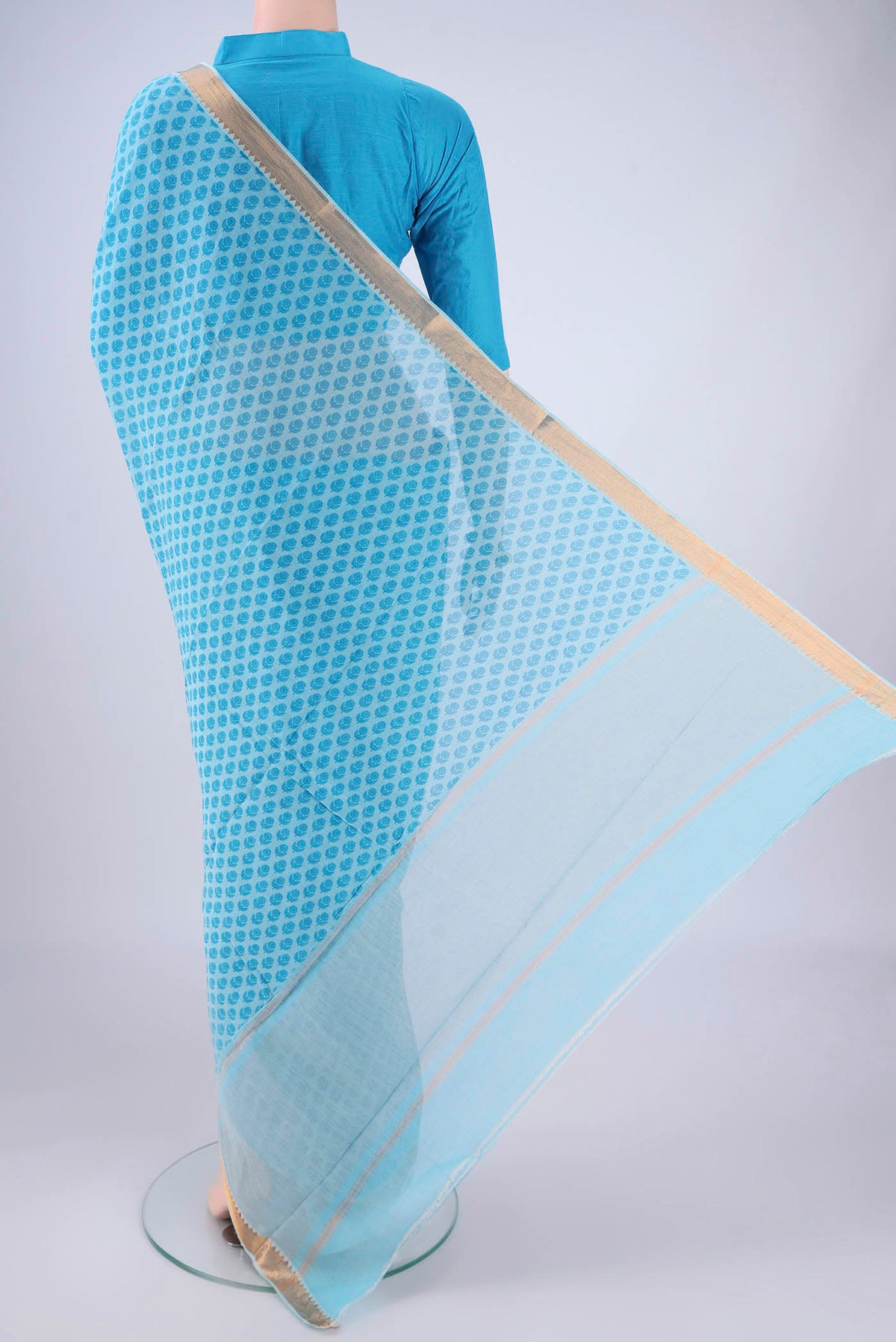 Flat view of Sky Blue Mangalagiri Cotton Saree with Printed design on the body and Zari Border. 