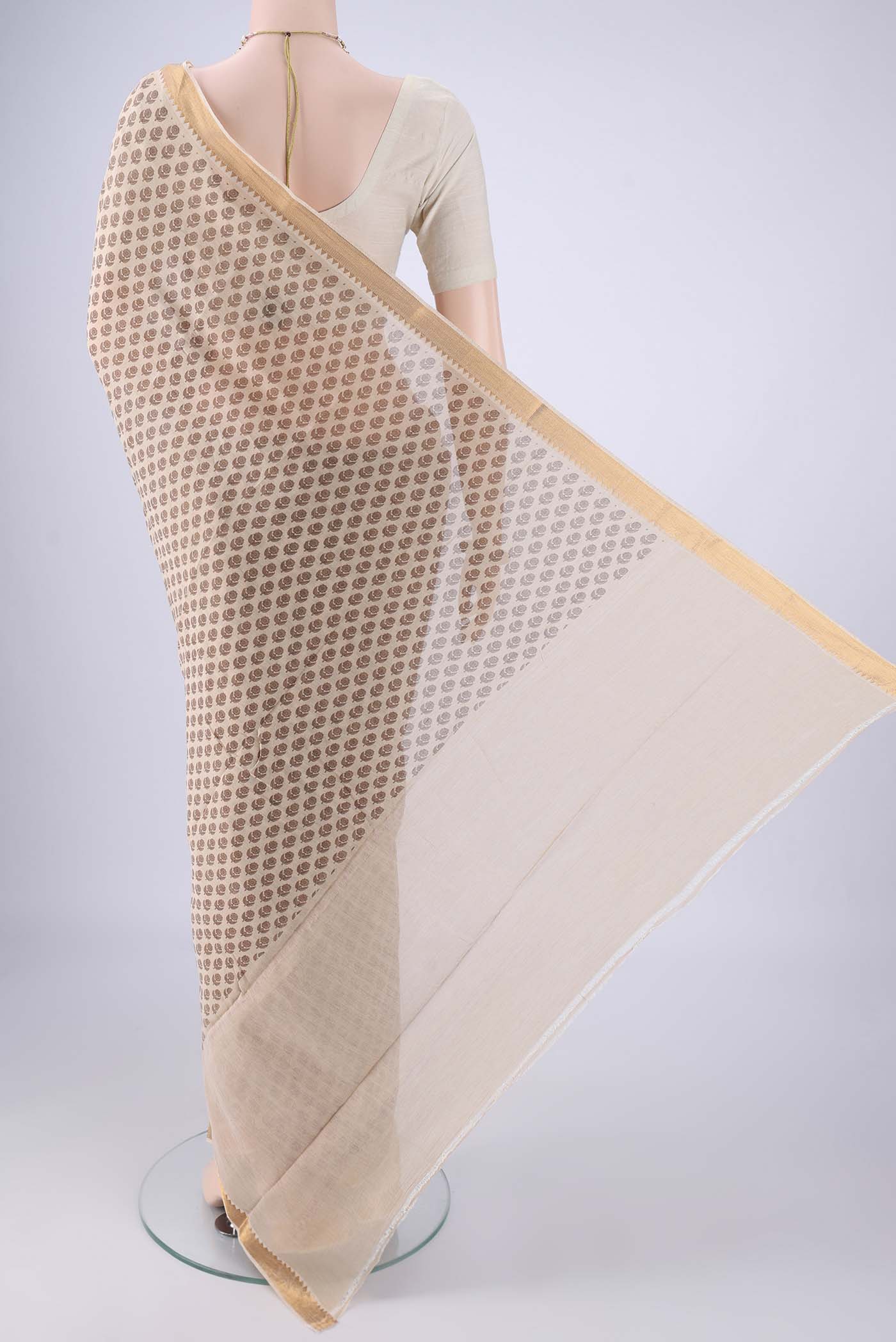 Flat view of Beige Mangalagiri Cotton Saree with Printed design on the body and Zari Border. 