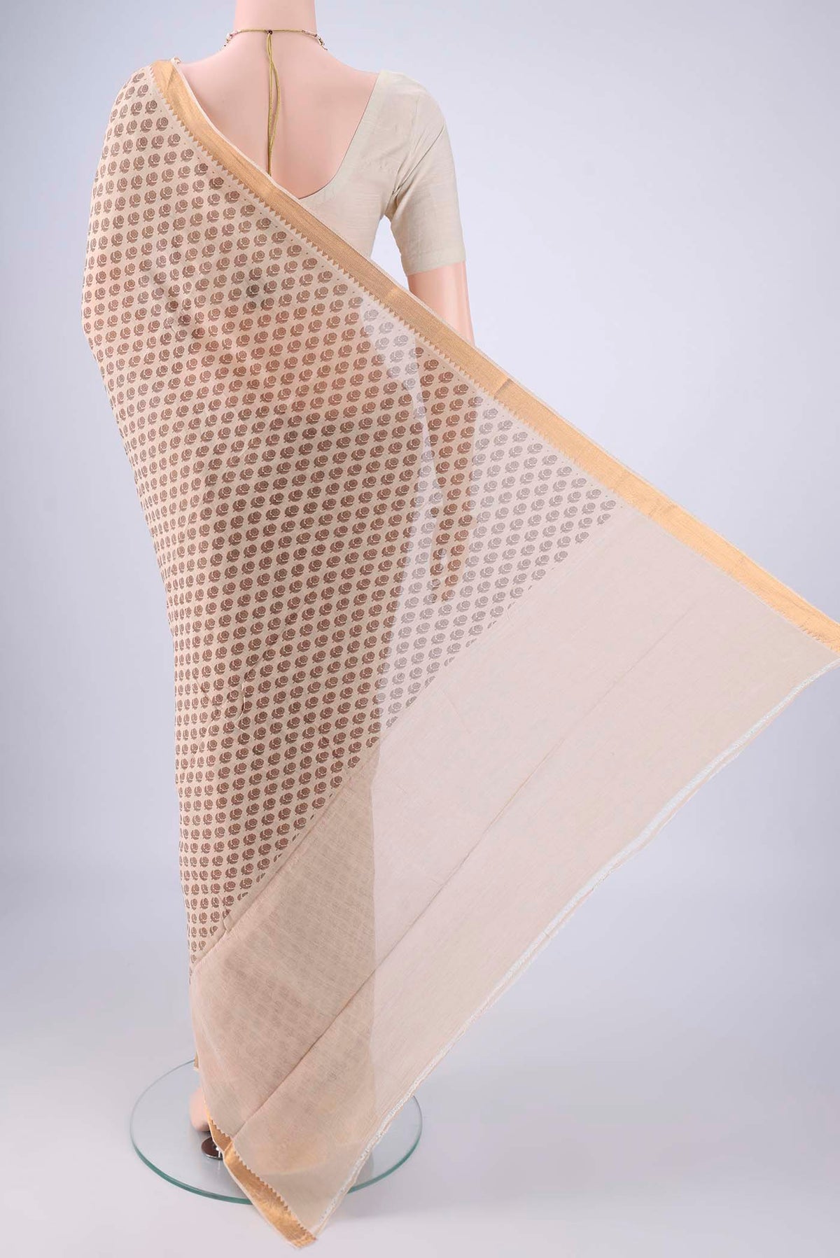 Flat view of Beige Mangalagiri Cotton Saree with Printed design on the body and Zari Border. 