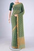 Green Mangalagiri Cotton Saree with Printed design on the body and Zari Border.  displayed on a mannequin