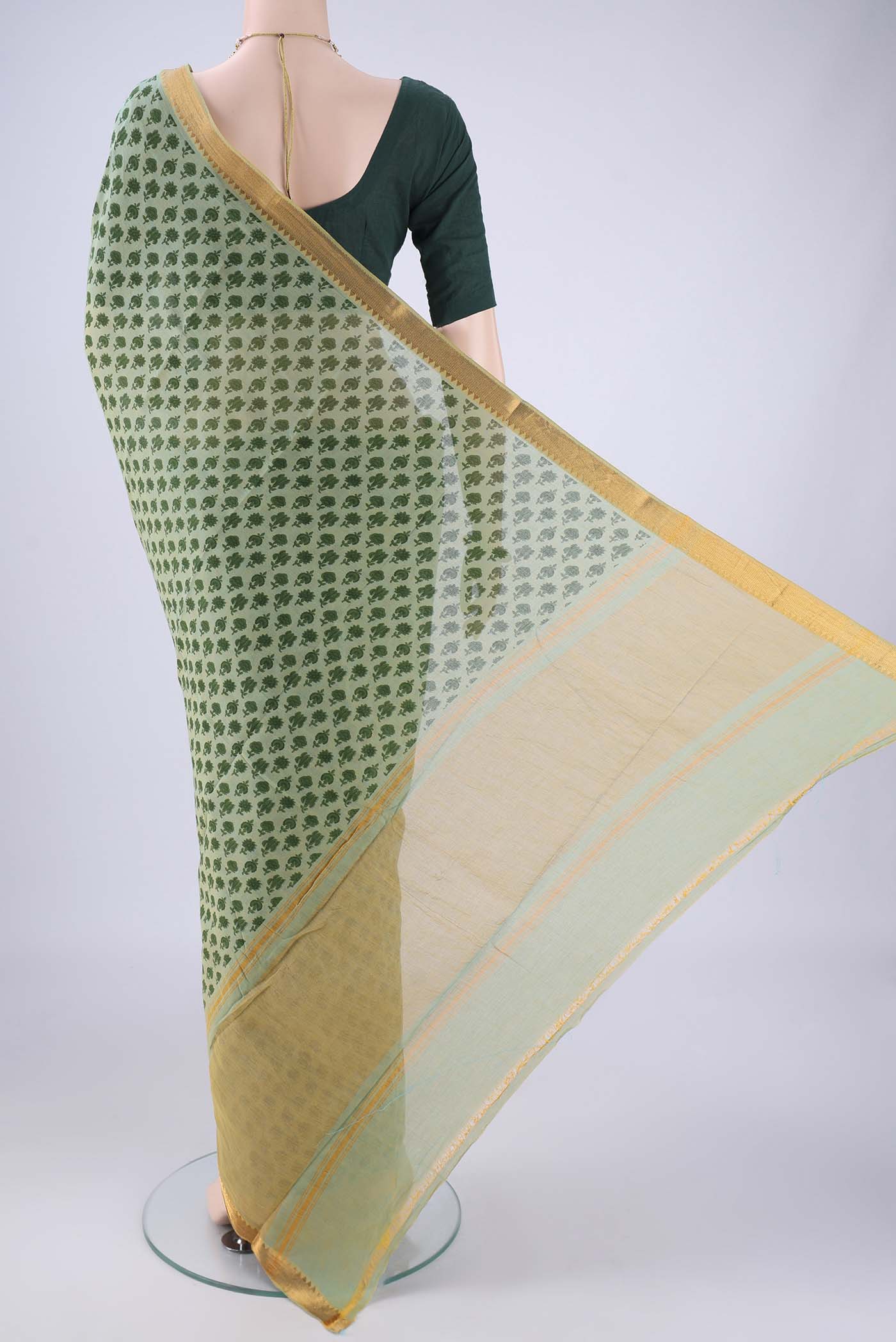 Flat view of Green Mangalagiri Cotton Saree with Printed design on the body and Zari Border. 