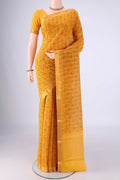 Yellow Mangalagiri Cotton Saree with Printed design on the body and Zari Border.  displayed on a mannequin