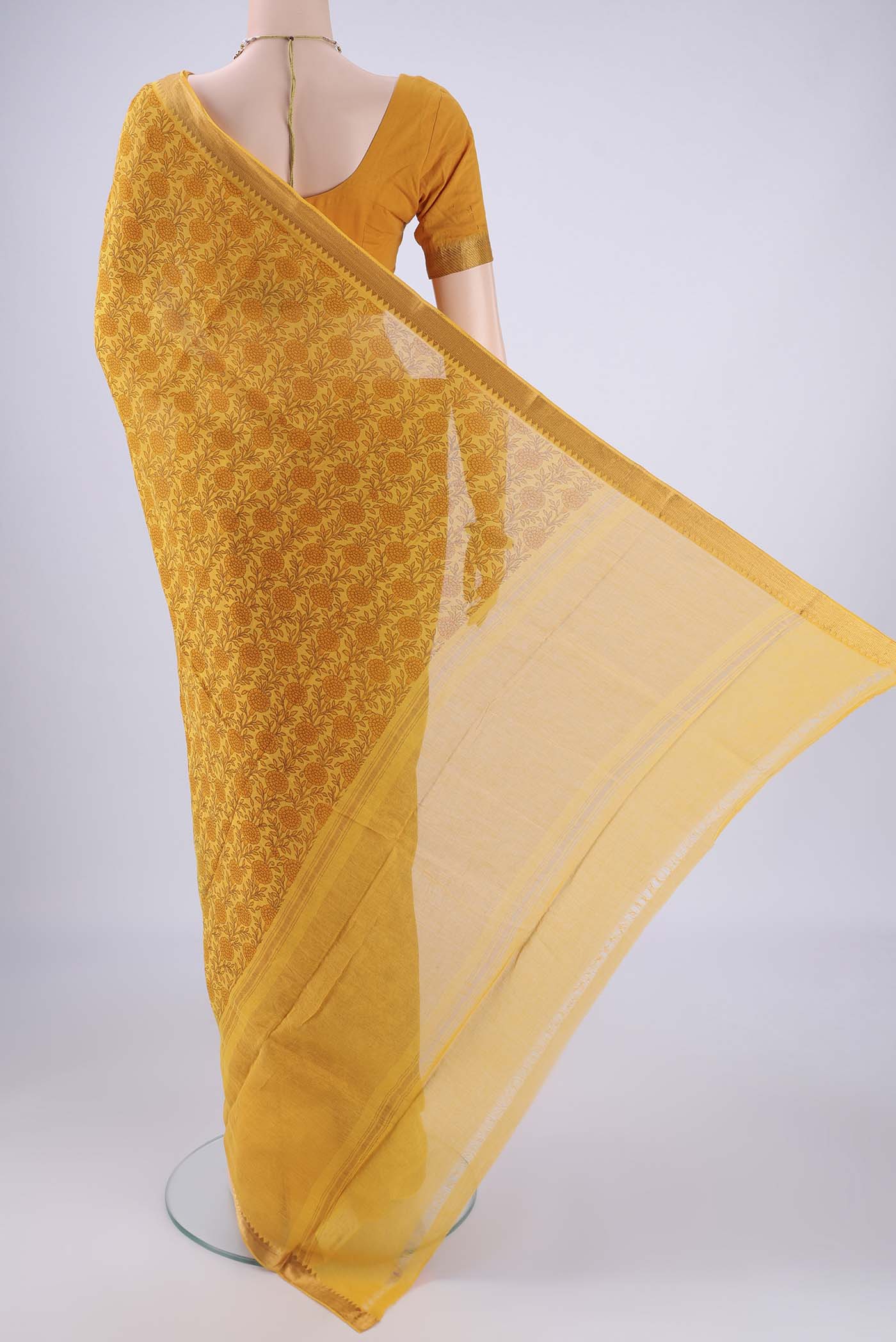 Flat view of Yellow Mangalagiri Cotton Saree with Printed design on the body and Zari Border. 