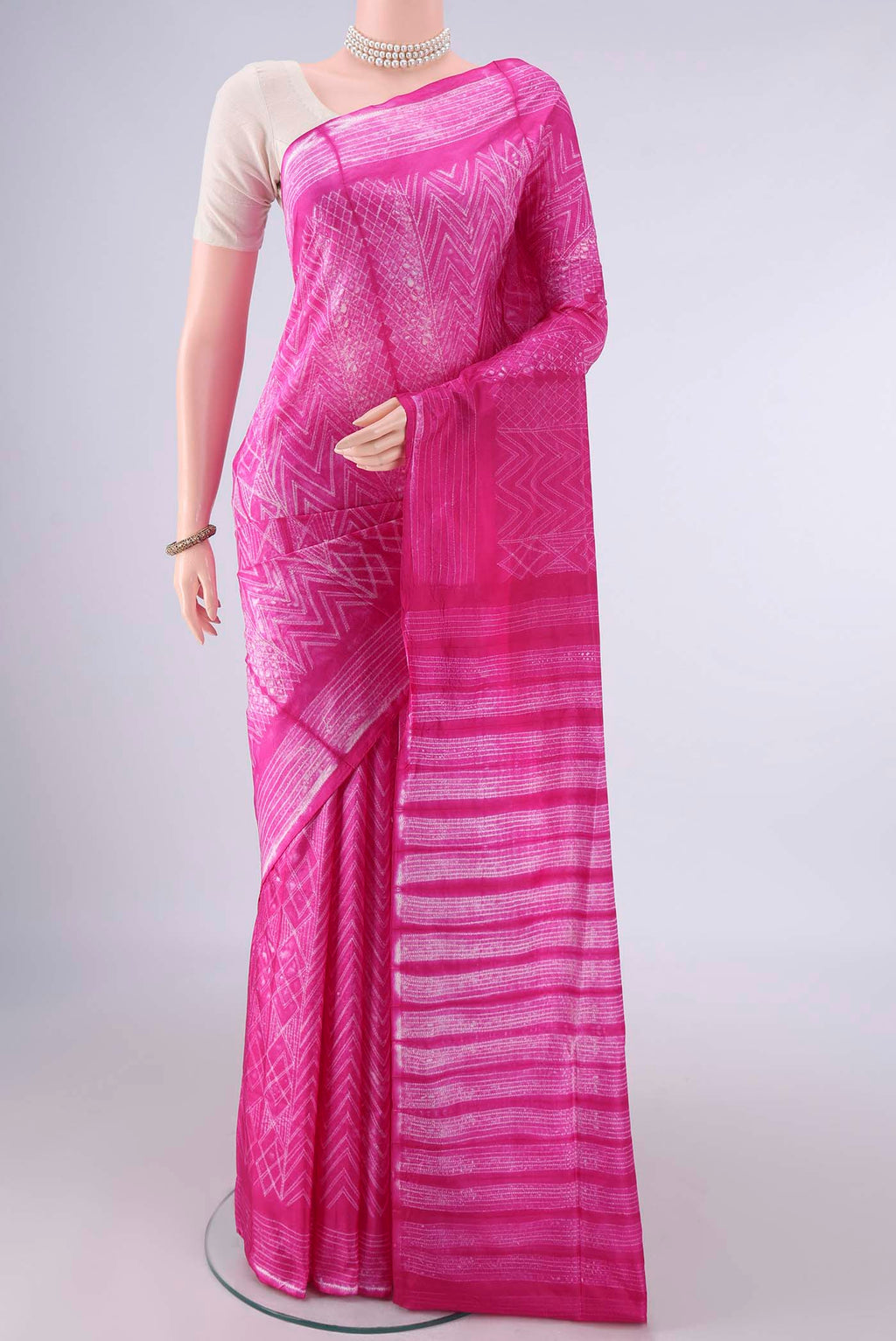 Pure Silk Rani Pink Printed Saree with Printed design on the body and Printed Border.  displayed on a mannequin