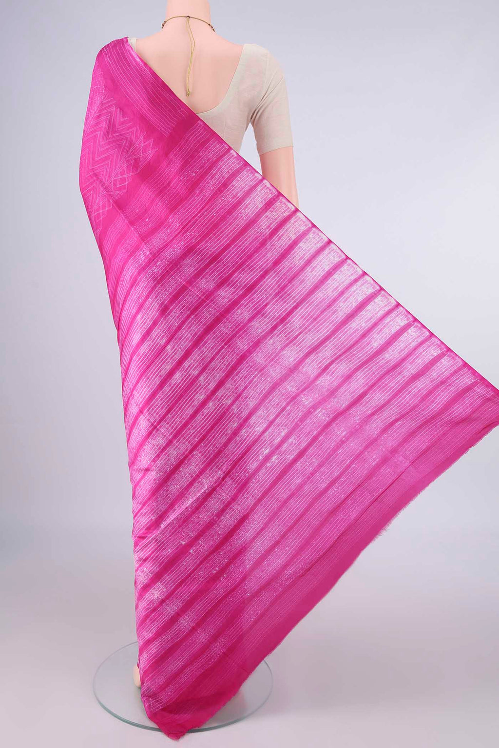Flat view of Pure Silk Rani Pink Printed Saree with Printed design on the body and Printed Border. 