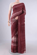 Rust Tussar Saree with Geometric Print on the body and Printed Border.  displayed on a mannequin