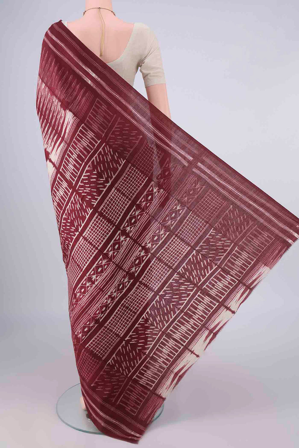 Flat view of Rust Tussar Saree with Geometric Print on the body and Printed Border. 