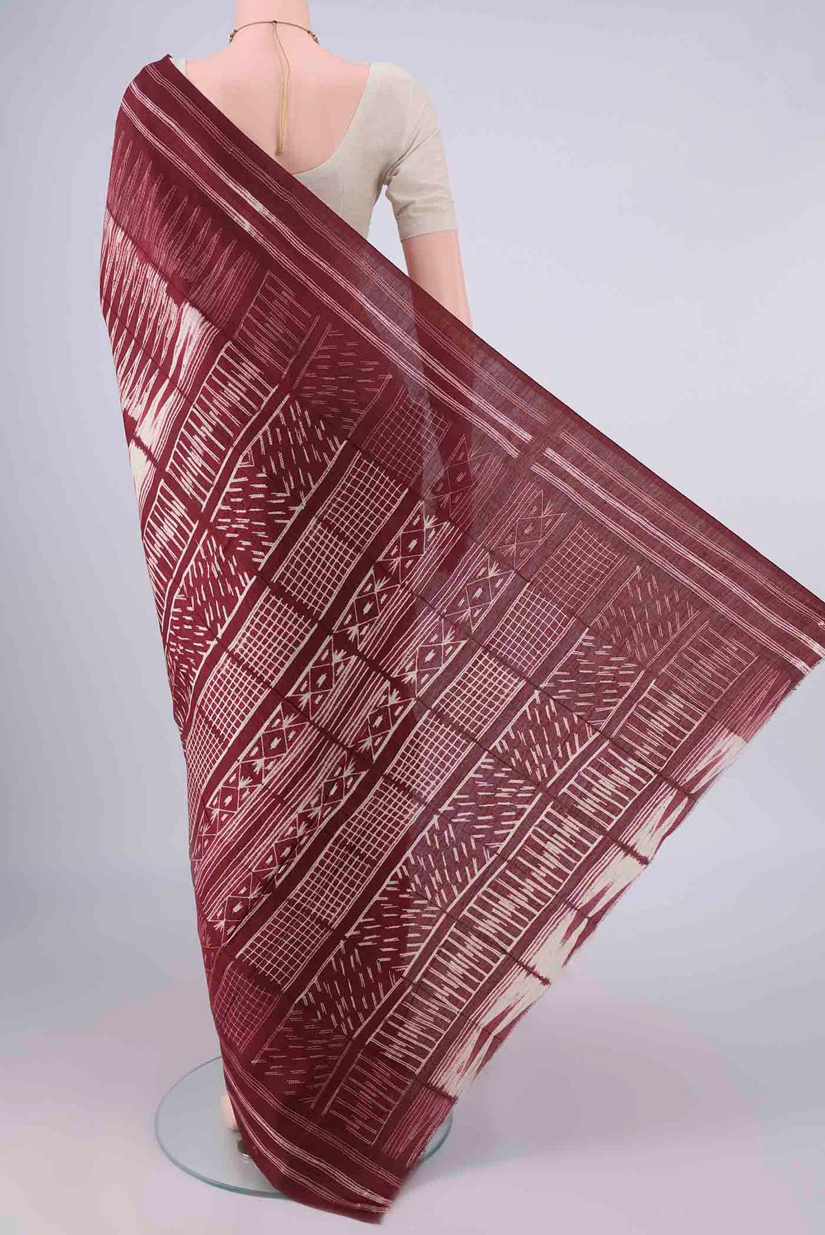 Flat view of Rust Tussar Saree with Geometric Print on the body and Printed Border. 