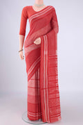Red Tussar Silk Saree with Zig Zag design on the body and Printed Border.  displayed on a mannequin
