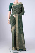 Bottle Green Mysore Crepe Saree with Zari Brocade on the body and Zari Border.  displayed on a mannequin