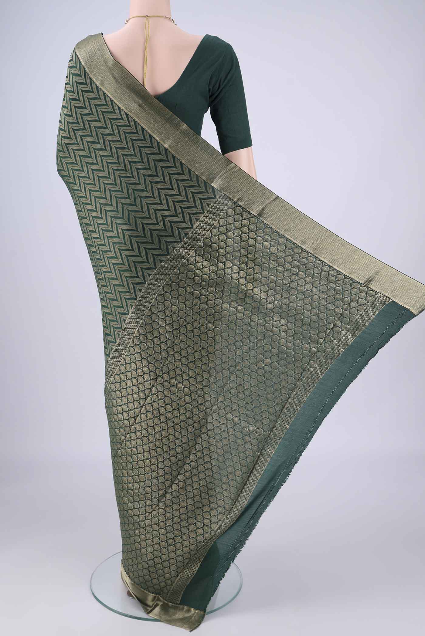 Flat view of Bottle Green Mysore Crepe Saree with Zari Brocade on the body and Zari Border. 