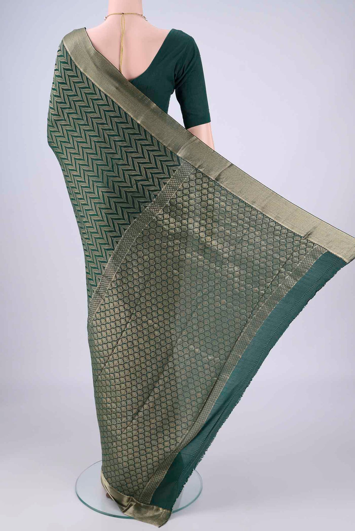 Flat view of Bottle Green Mysore Crepe Saree with Zari Brocade on the body and Zari Border. 