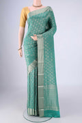 Sea Green Mysore Crepe Saree with Zari Brocade on the body and Zari Border.  displayed on a mannequin