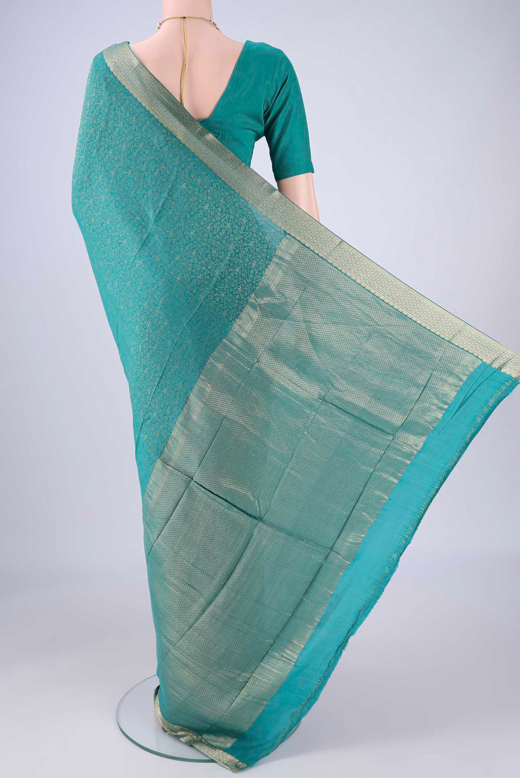Flat view of Sea Green Mysore Crepe Saree with Zari Brocade on the body and Zari Border. 