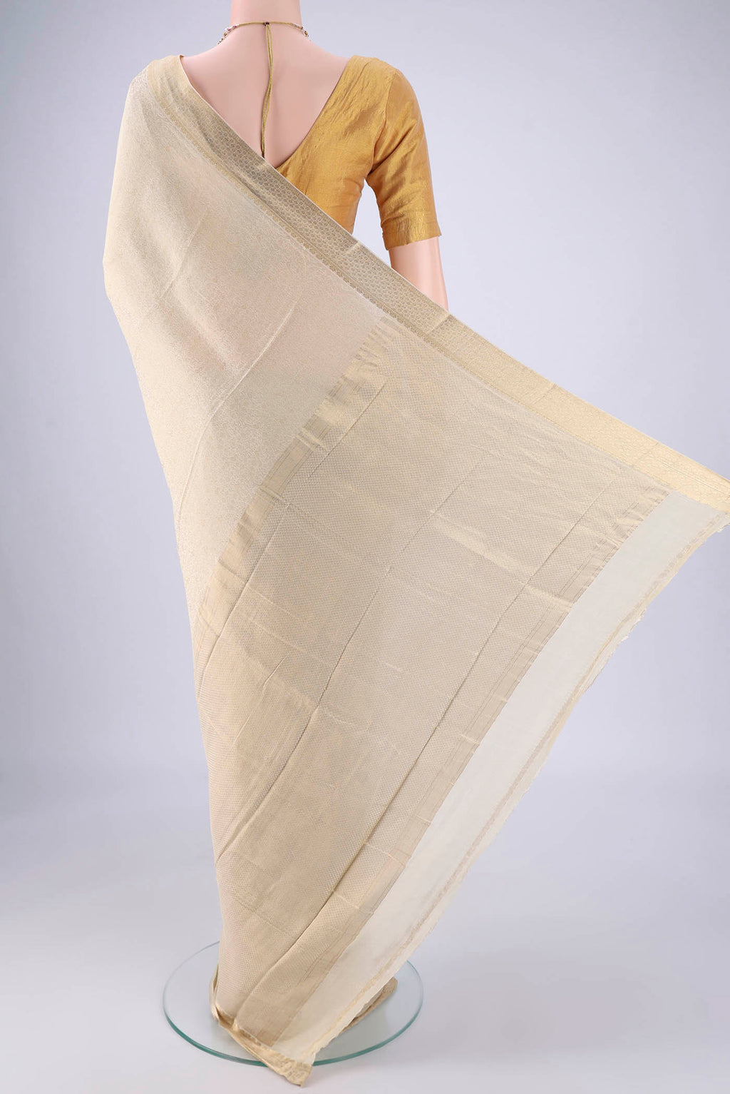 Flat view of Cream Mysore Crepe Saree with Zari Brocade on the body and Zari Border. 