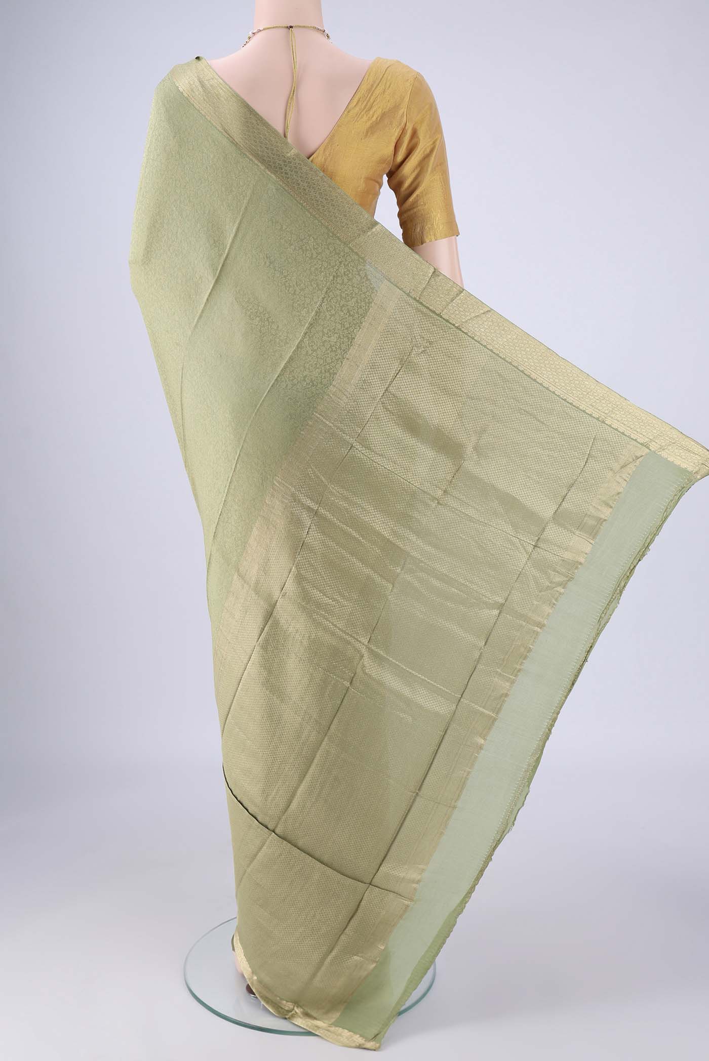 Flat view of Sage Green Mysore Crepe Saree with Zari Brocade on the body and Zari Border. 