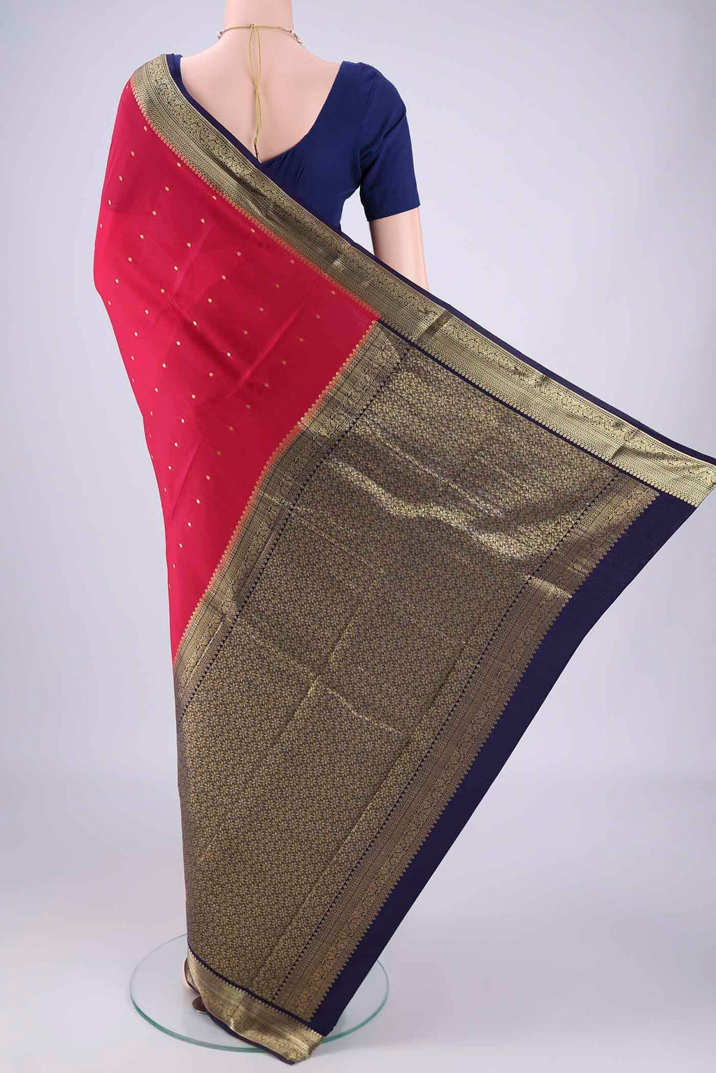 Flat view of Rani Pink Mysore Crepe Saree with Zari Butta on the body and Zari Border. 