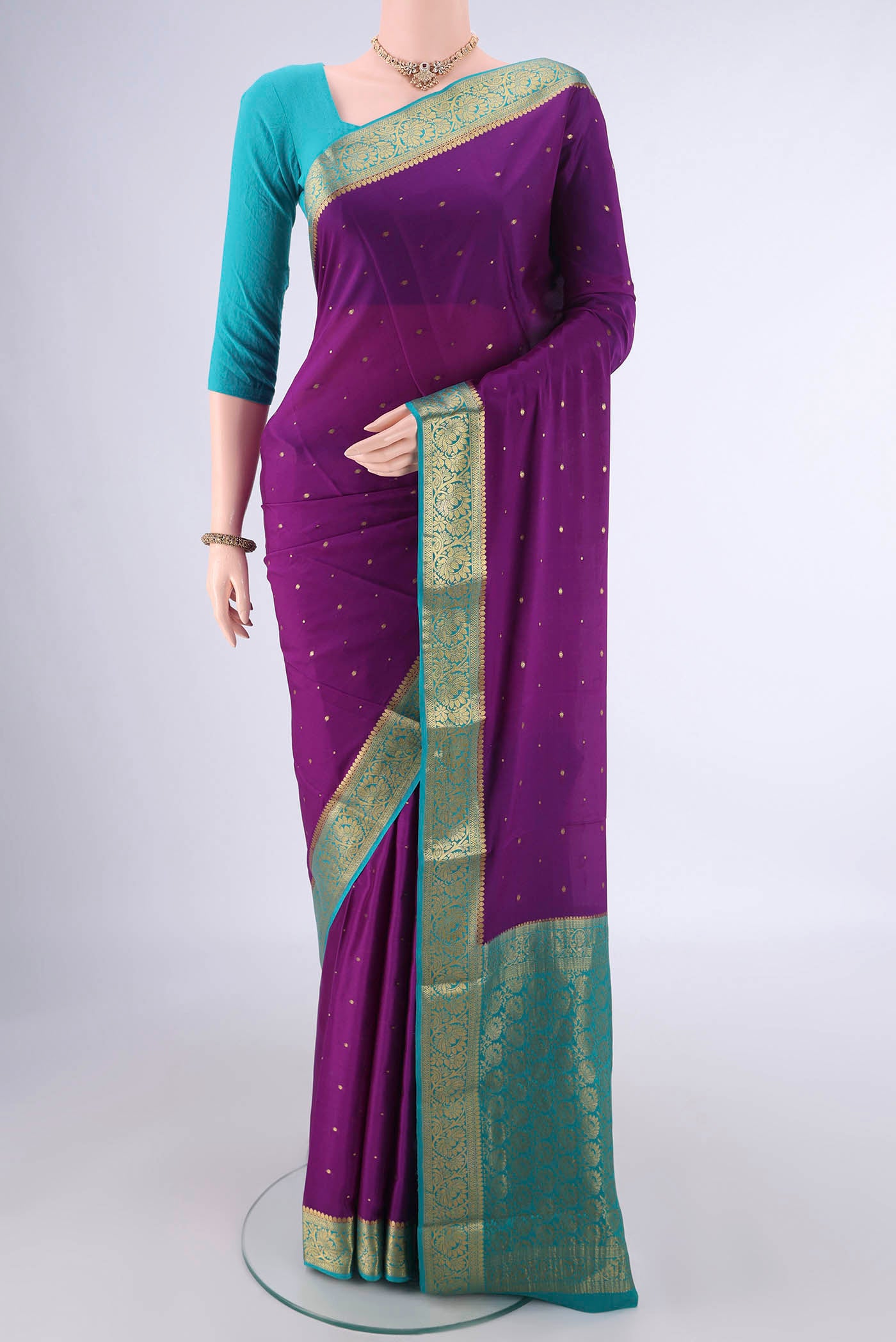 Purple Mysore Crepe Saree with Zari Butta on the body and Zari Border.  displayed on a mannequin