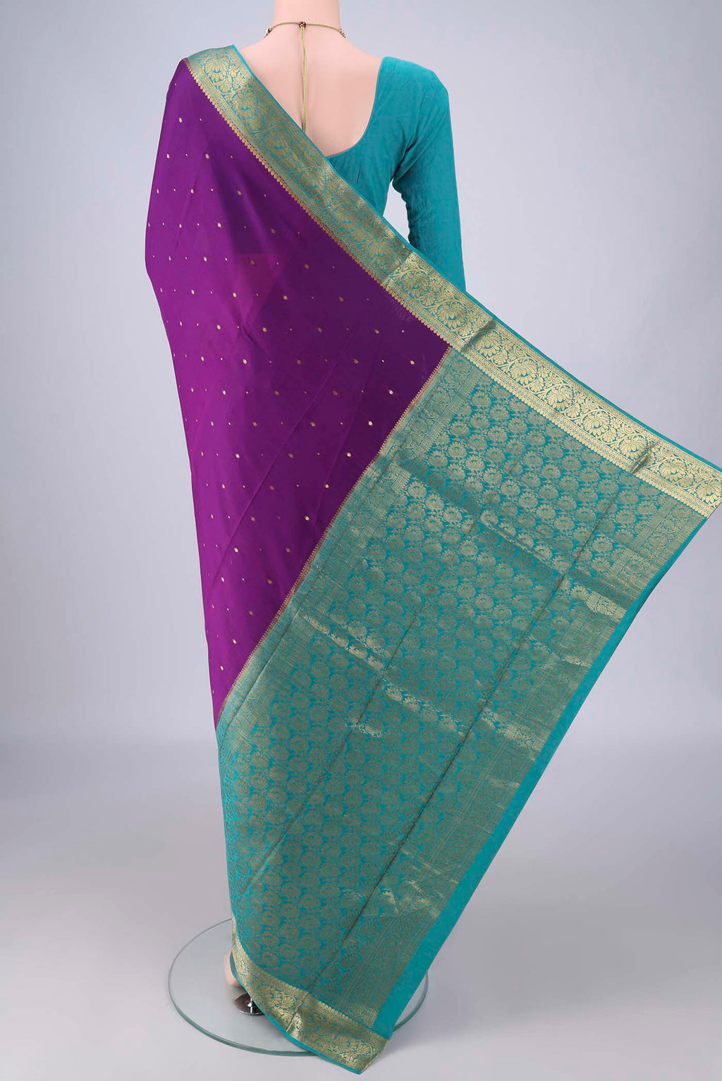 Flat view of Purple Mysore Crepe Saree with Zari Butta on the body and Zari Border. 