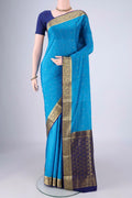 Blue Mysore Crepe Saree with Zari Butta on the body and Zari Border.  displayed on a mannequin