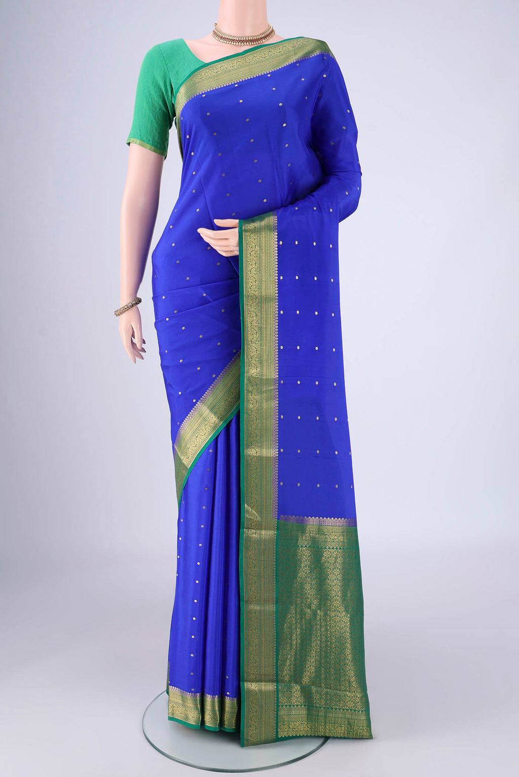 Royal Blue Mysore Crepe Saree with Zari Butta on the body and Zari Border.  displayed on a mannequin