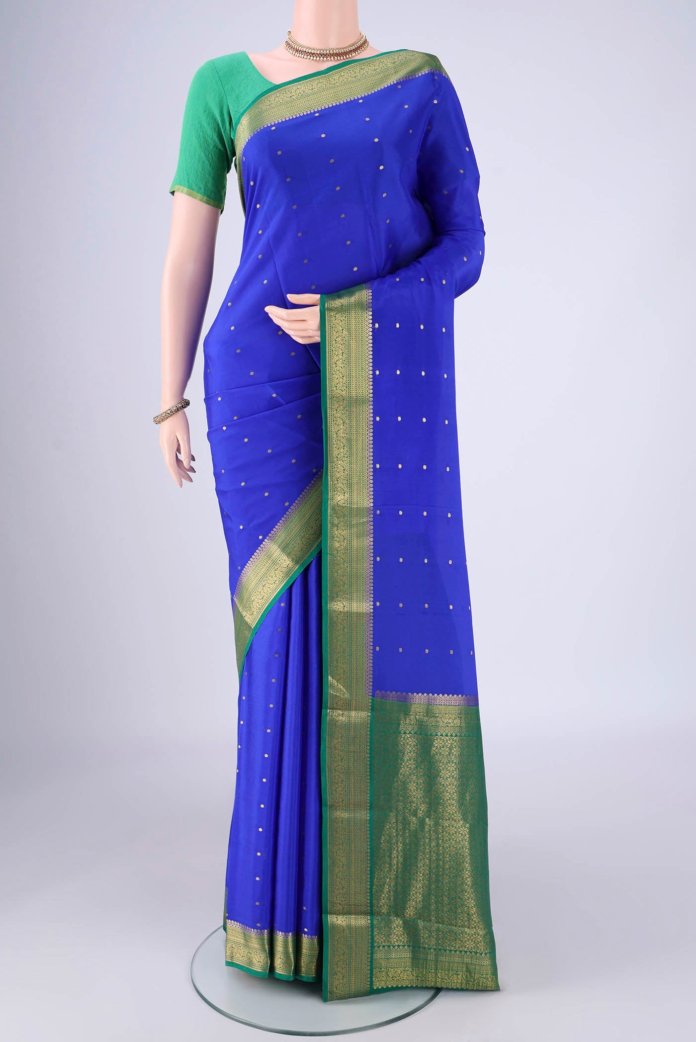 Royal Blue Mysore Crepe Saree with Zari Butta on the body and Zari Border.  displayed on a mannequin