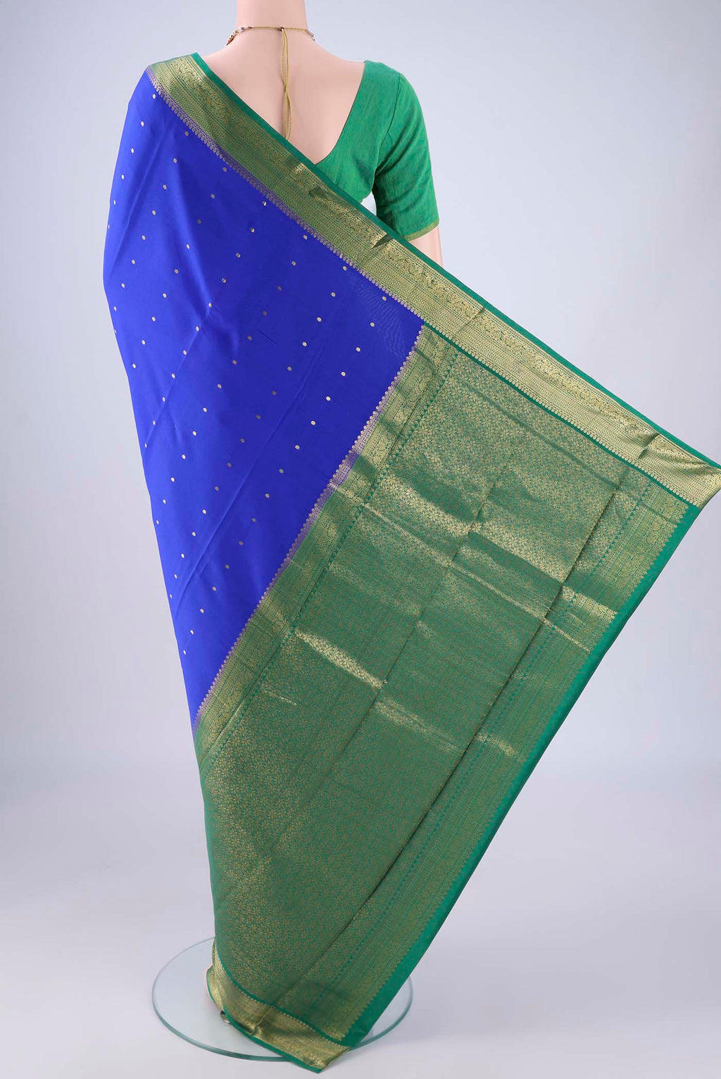 Flat view of Royal Blue Mysore Crepe Saree with Zari Butta on the body and Zari Border. 
