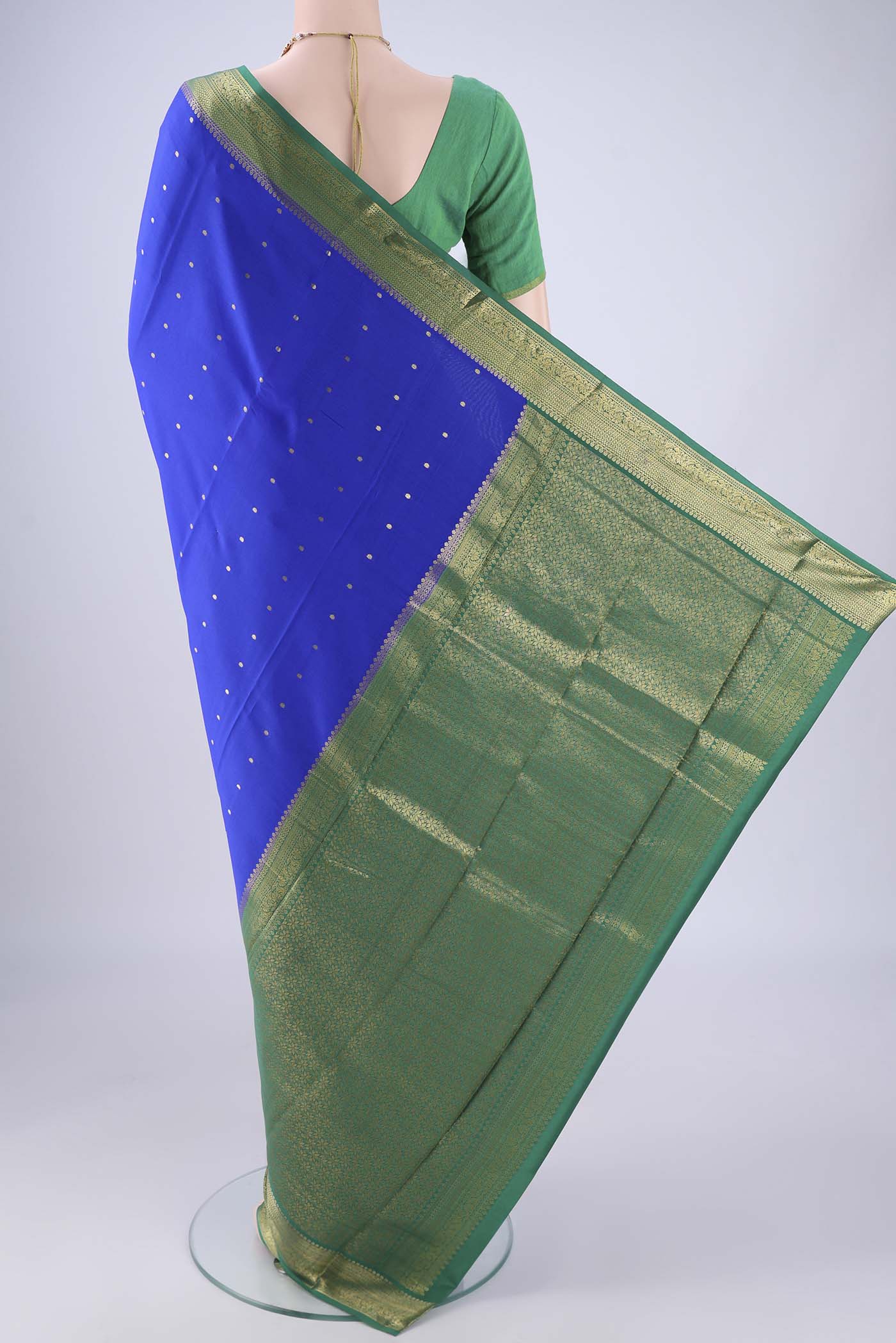 Flat view of Royal Blue Mysore Crepe Saree with Zari Butta on the body and Zari Border. 